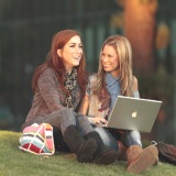 Students Sitting Grass with Laptop