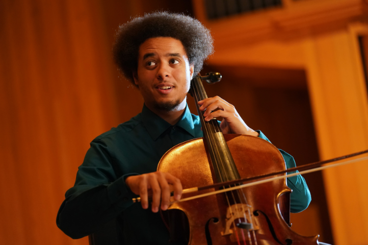 student playing a cello