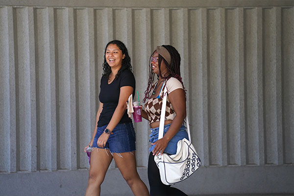 Student in front of the library