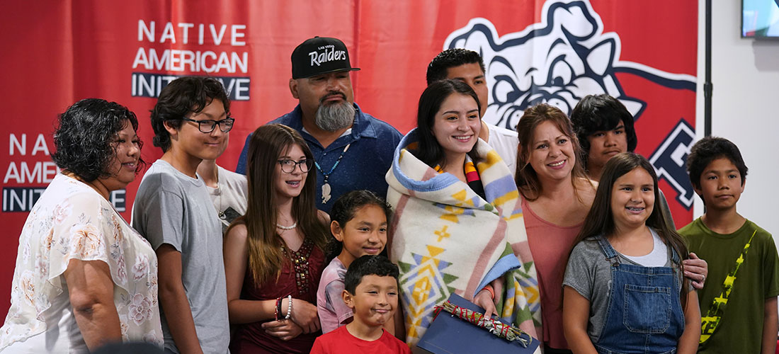 Native American grad and family