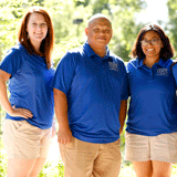 Dogs day Staff with Tree in the Background