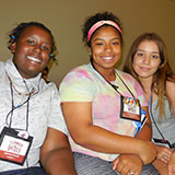 Three People Smiling at the Camera