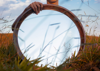 person holding a mirror