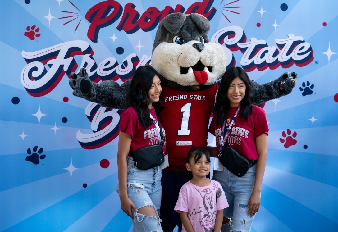 photo of two new students and a child posing with Timeout