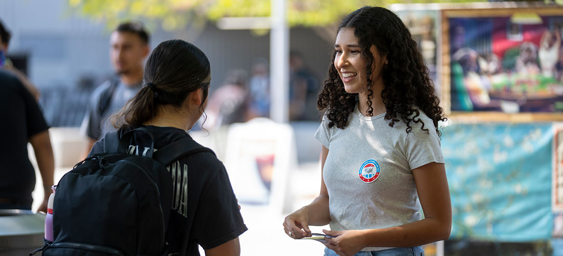 Student handing out stickers