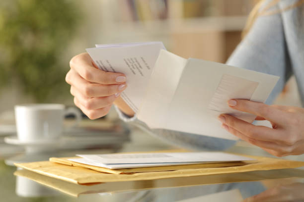 Woman opening letter