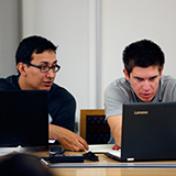 Two Students Looking at PC