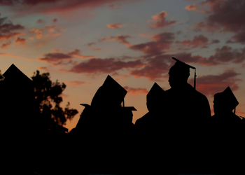 Sunset Image of Students at Commencement Ceremony