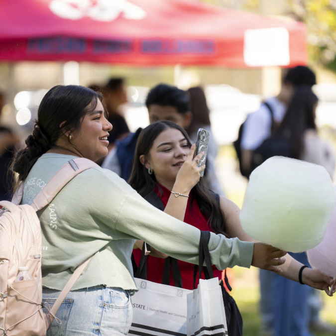 A member of the Spotlight committee poses at the Halloween carnival