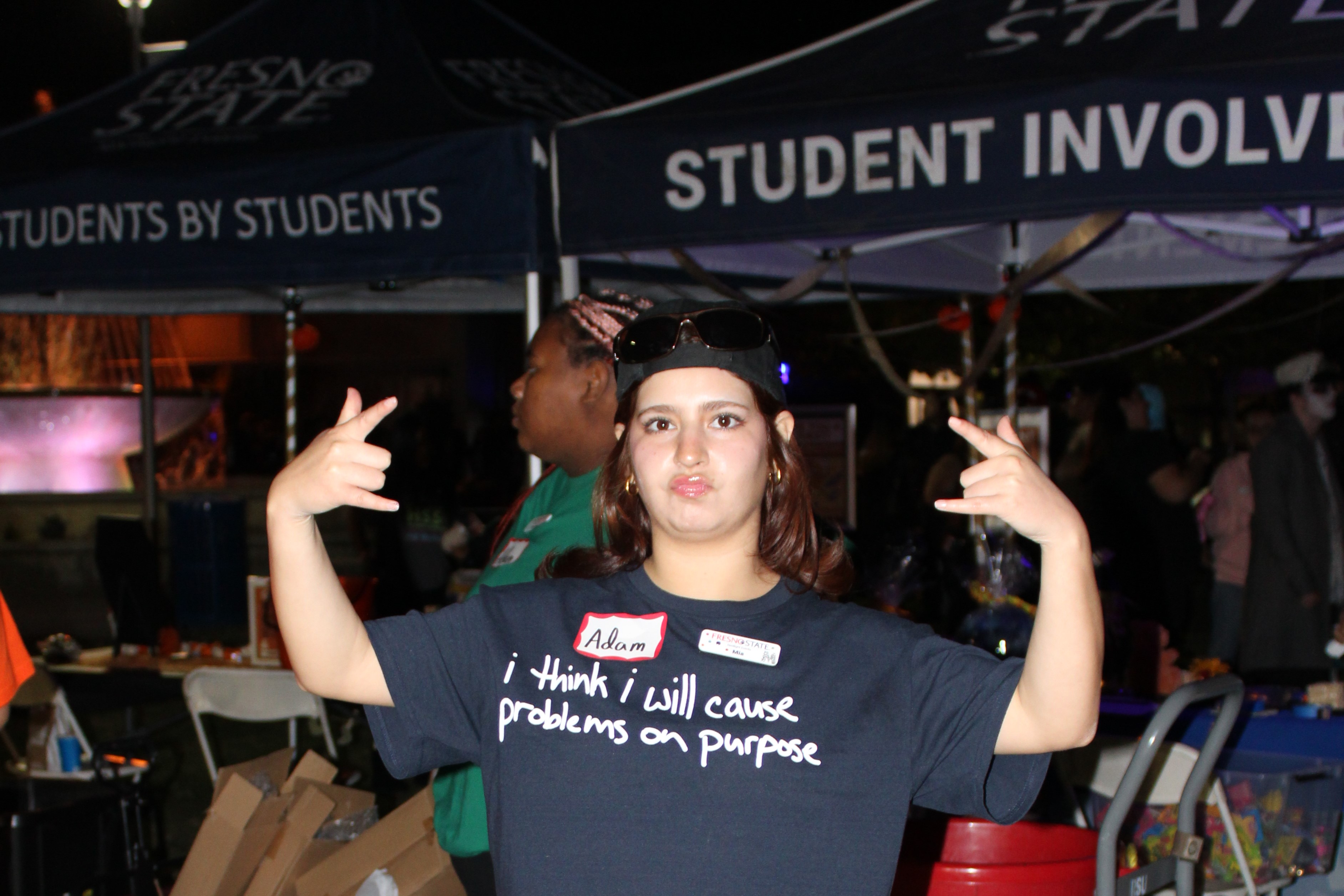 A member of the Spotlight committee poses at the Halloween carnival