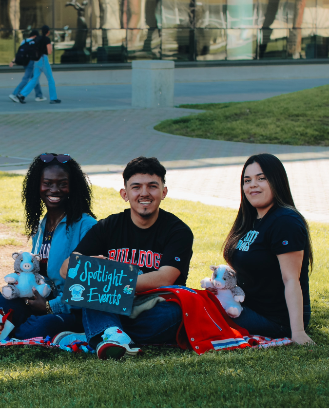 Two members of the Spotlight committee table and greet students