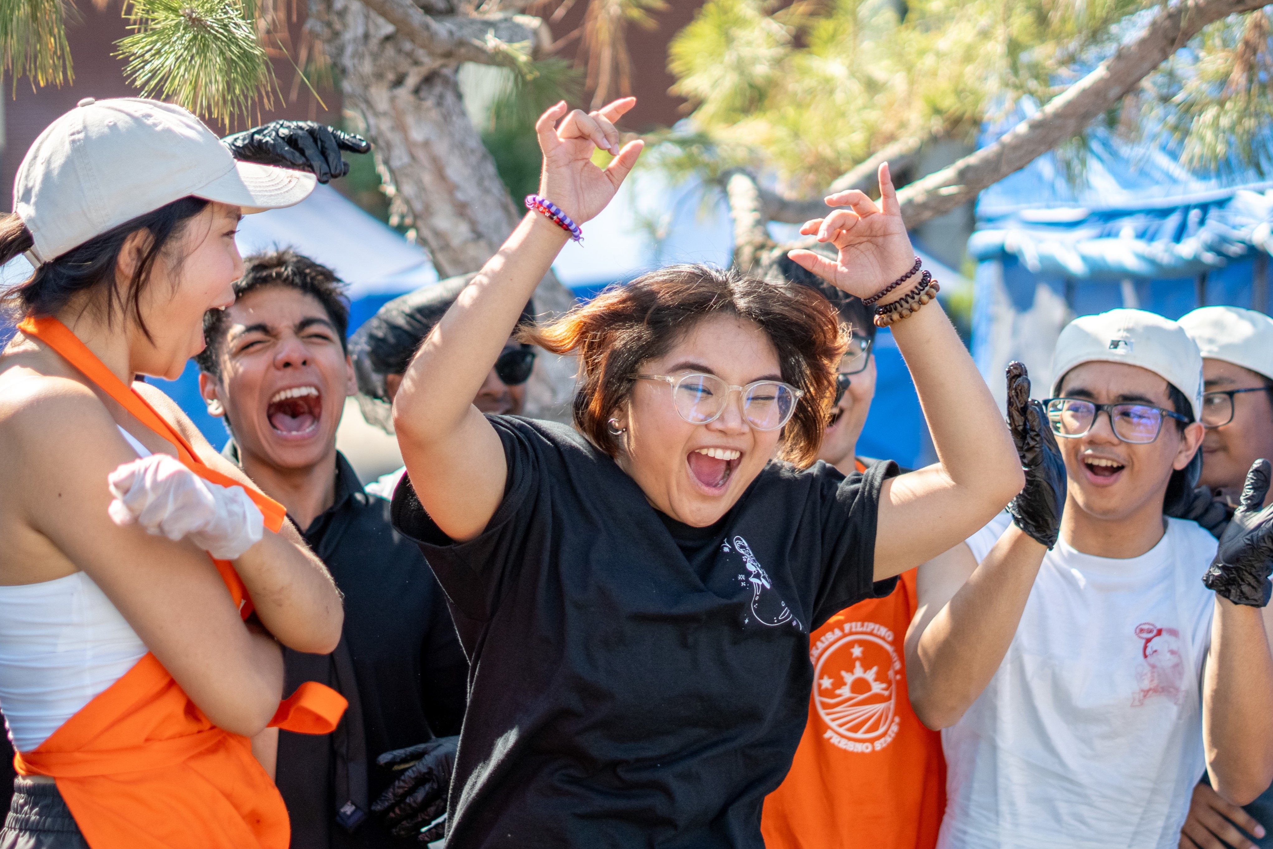 A student organization celebrates their food booth win