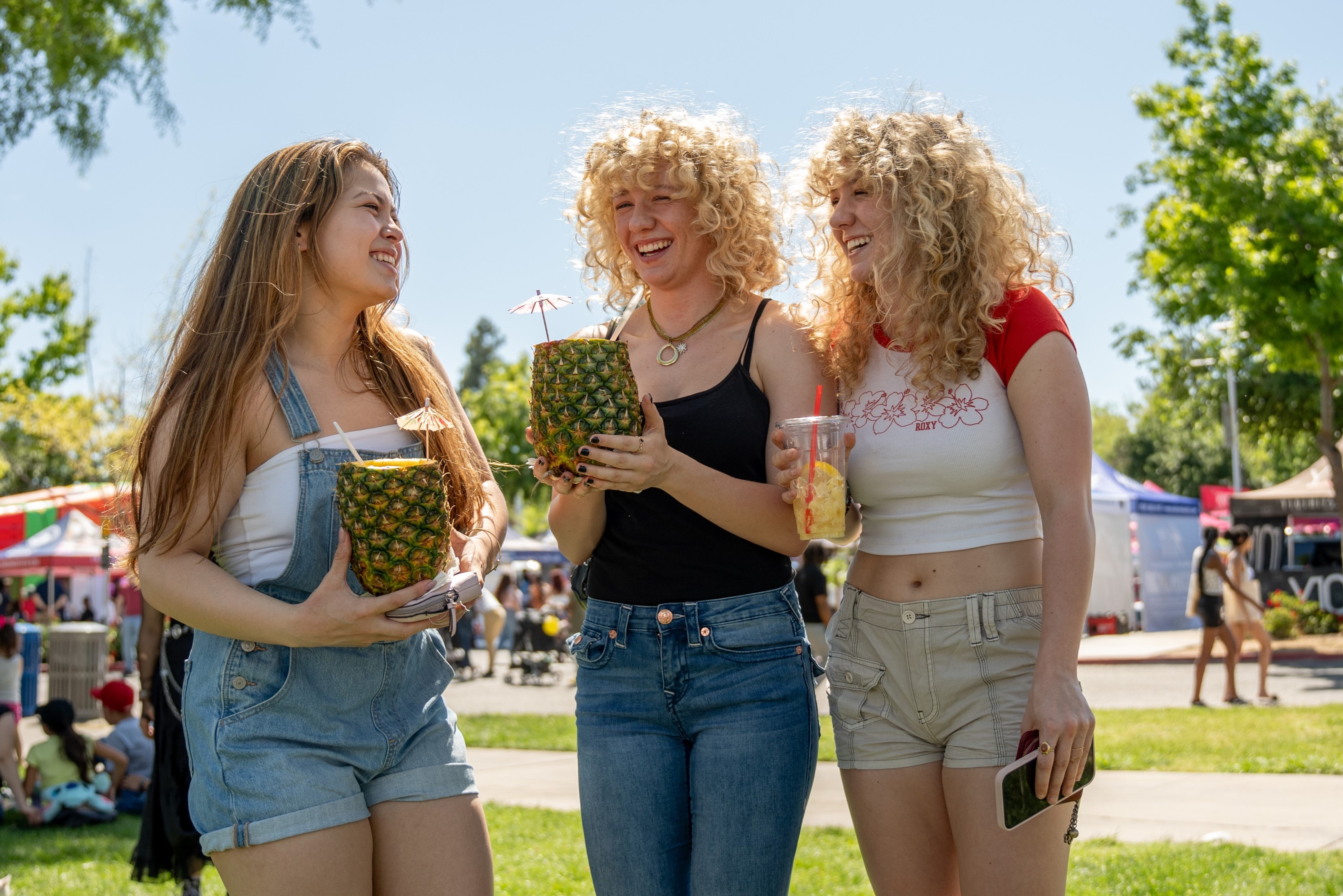 Three students enjoying Vintage Days' festivities