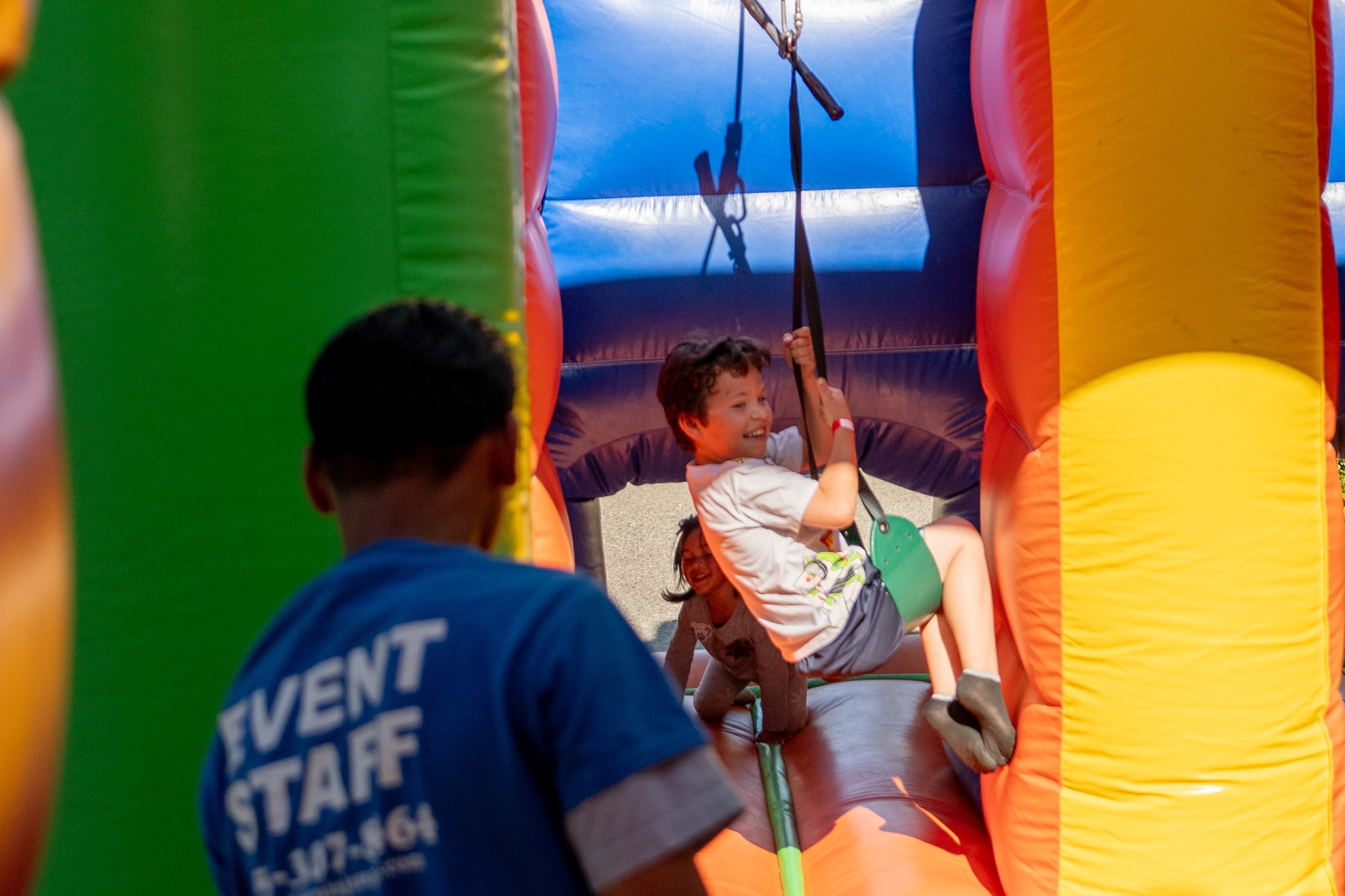 Kids going down inflatable zipline