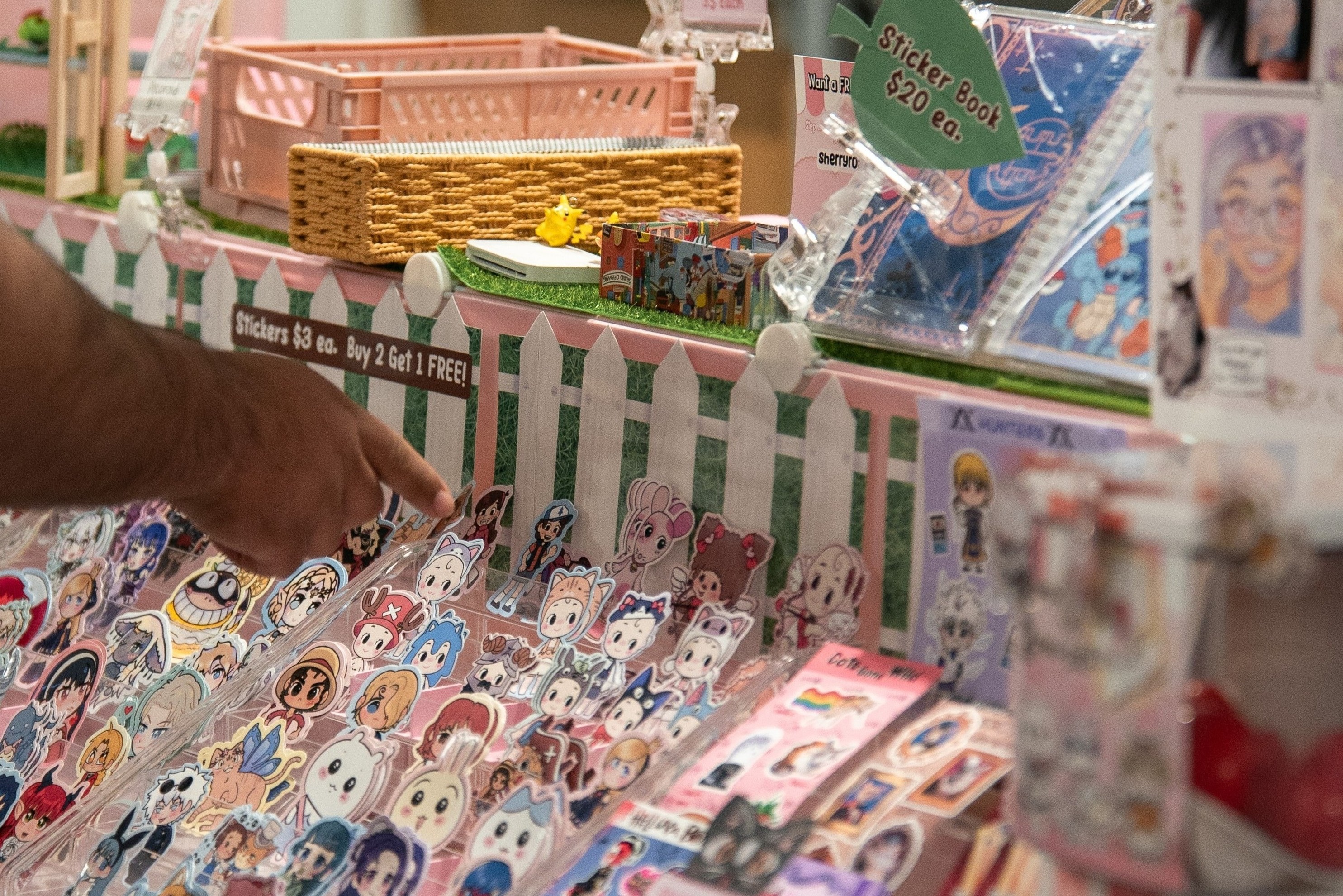 An artist booth's expansive sticker offerings