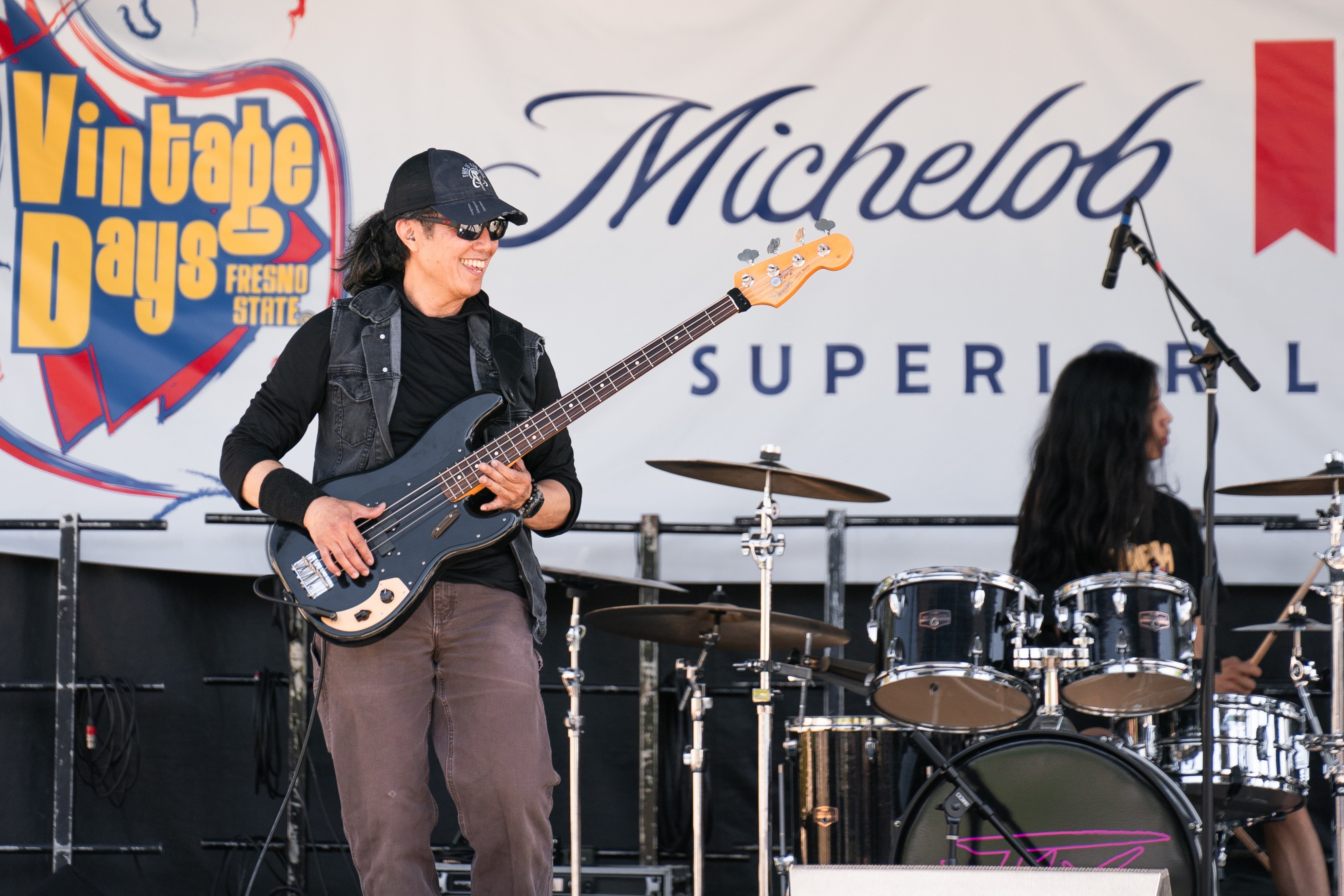 Bassist smiles while performing