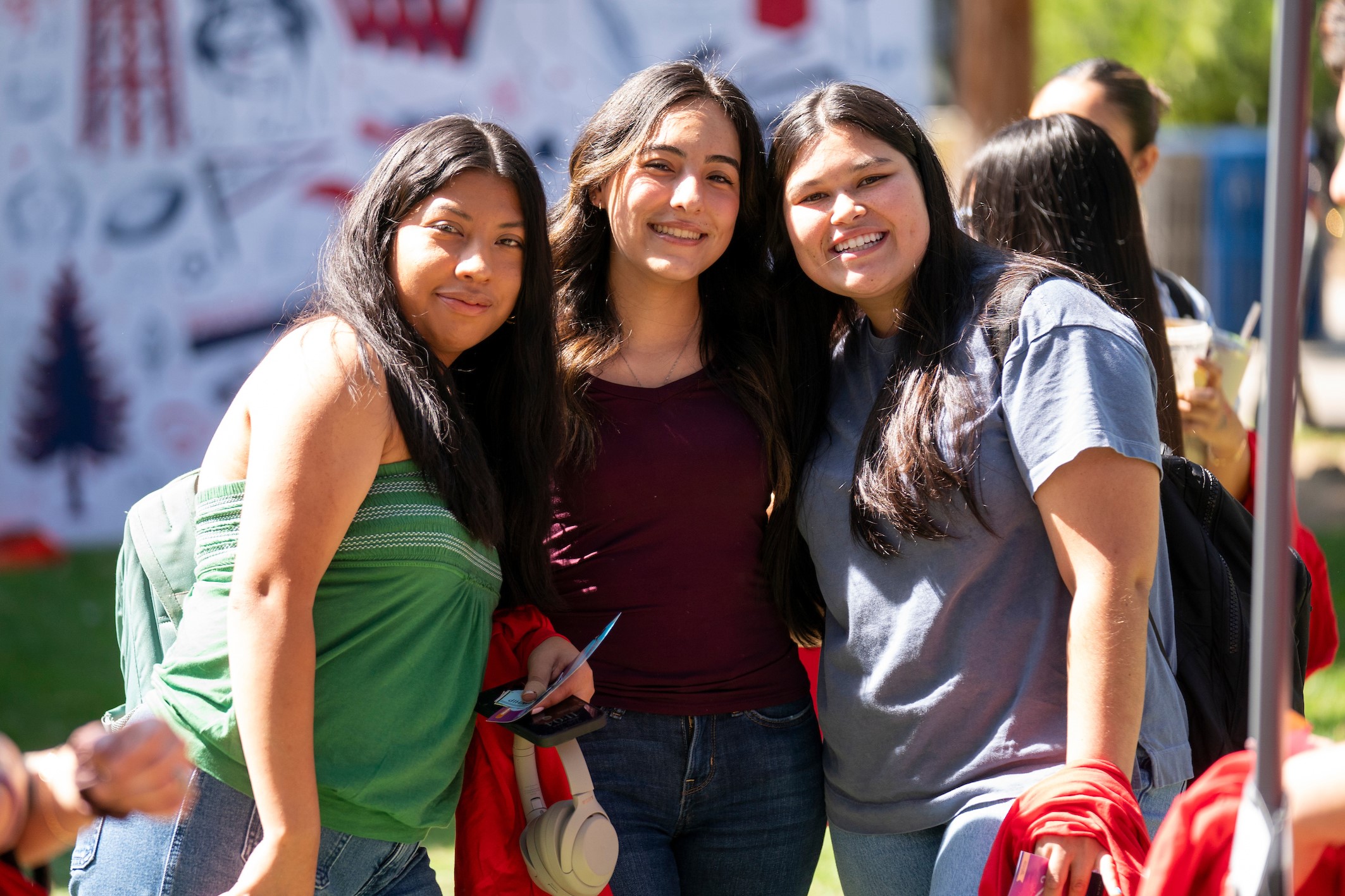 Three students pose at the Big Bulldog Welcome