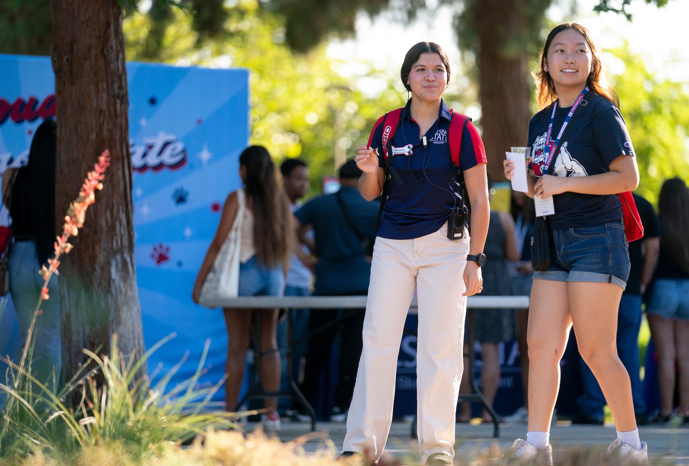 Two student employees enjoy an event held in the Memorial Gardens