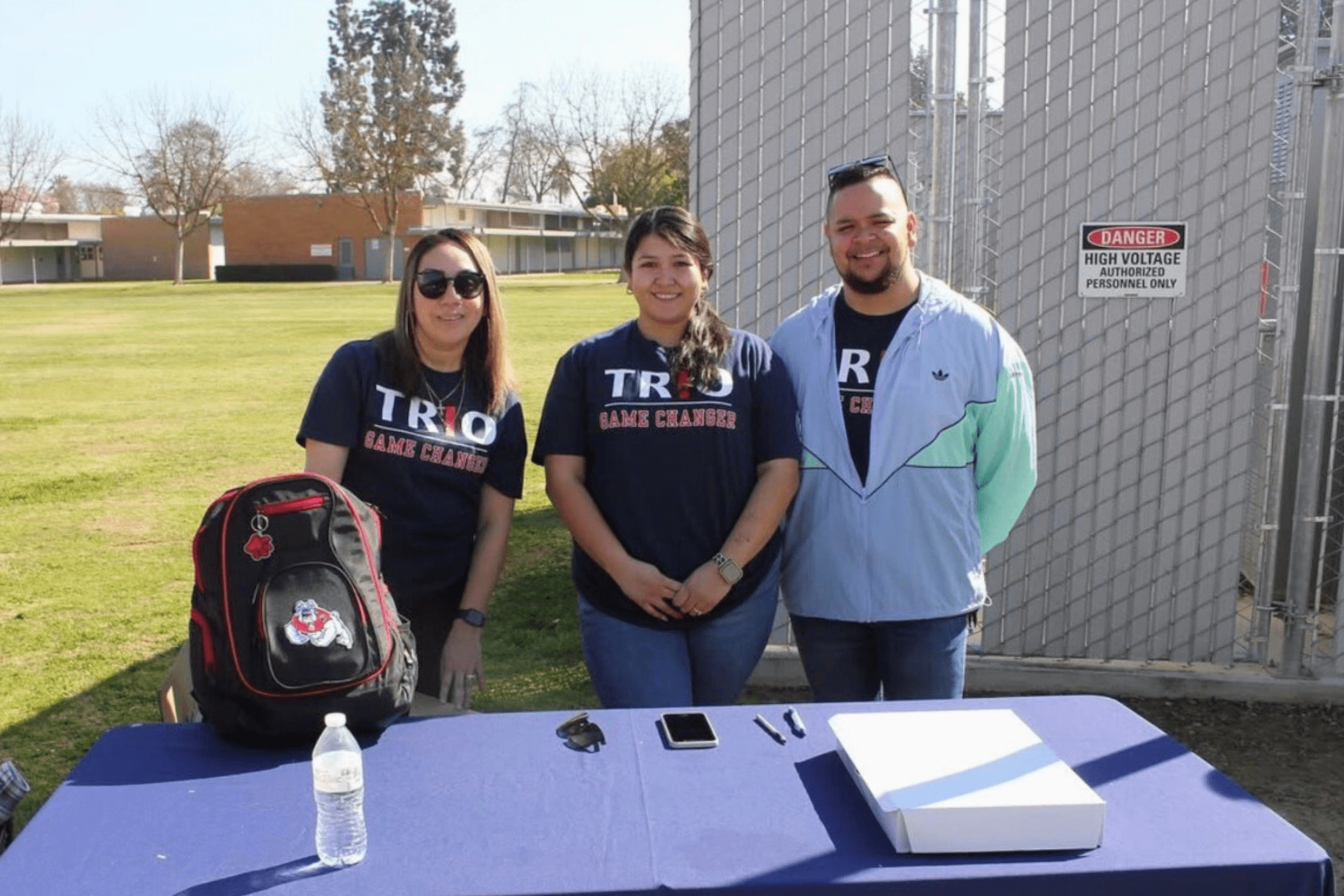 Fresno State Upward Bound Counselors Anna, Jasmin, and Luis tabling for recruitment