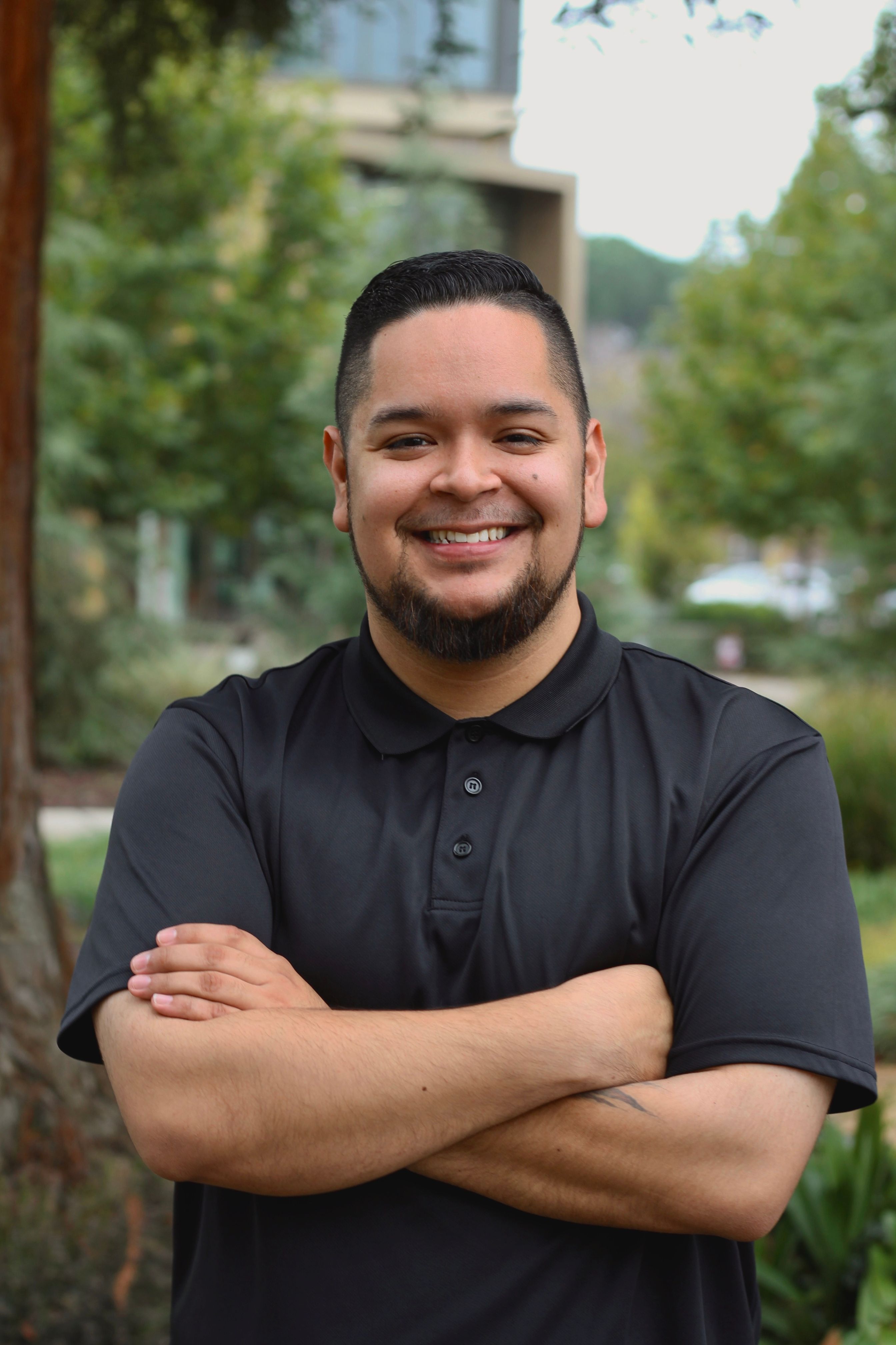 picture of Luis Alvarez Ordaz, Classic Counselor of Upward Bound Programs, standing outside of RSU garden
