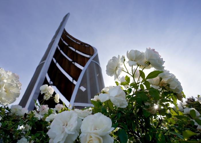 Spiral monument with flowers in front