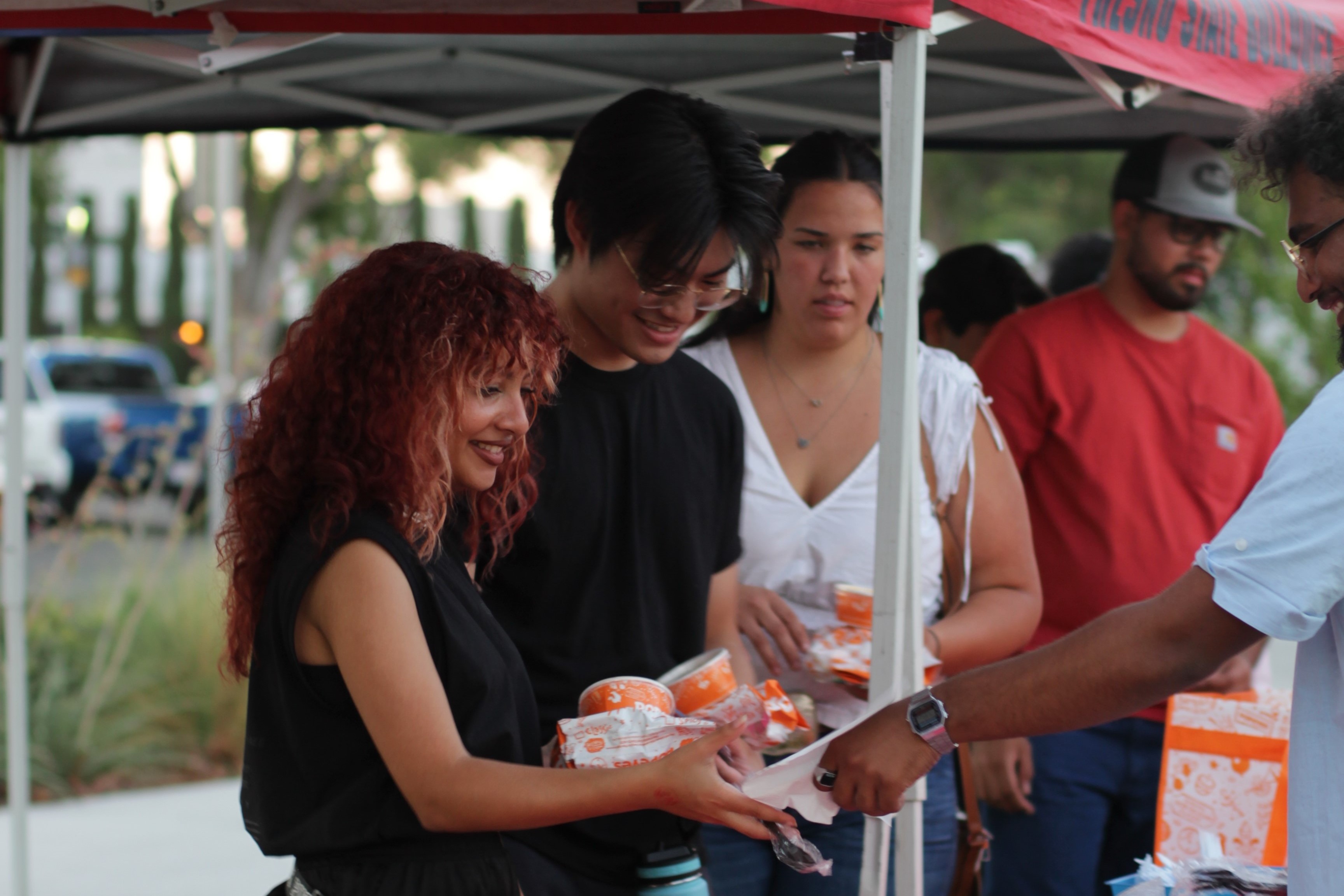 Students wait in line for Popeyes at the Sunset Picnic