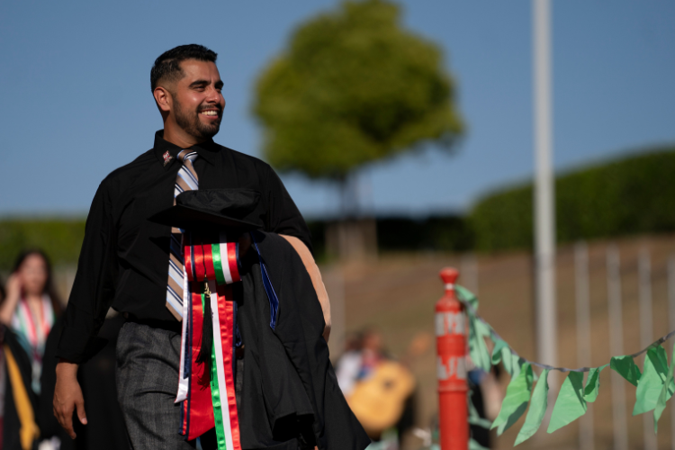 Student walking after graduation ceremony