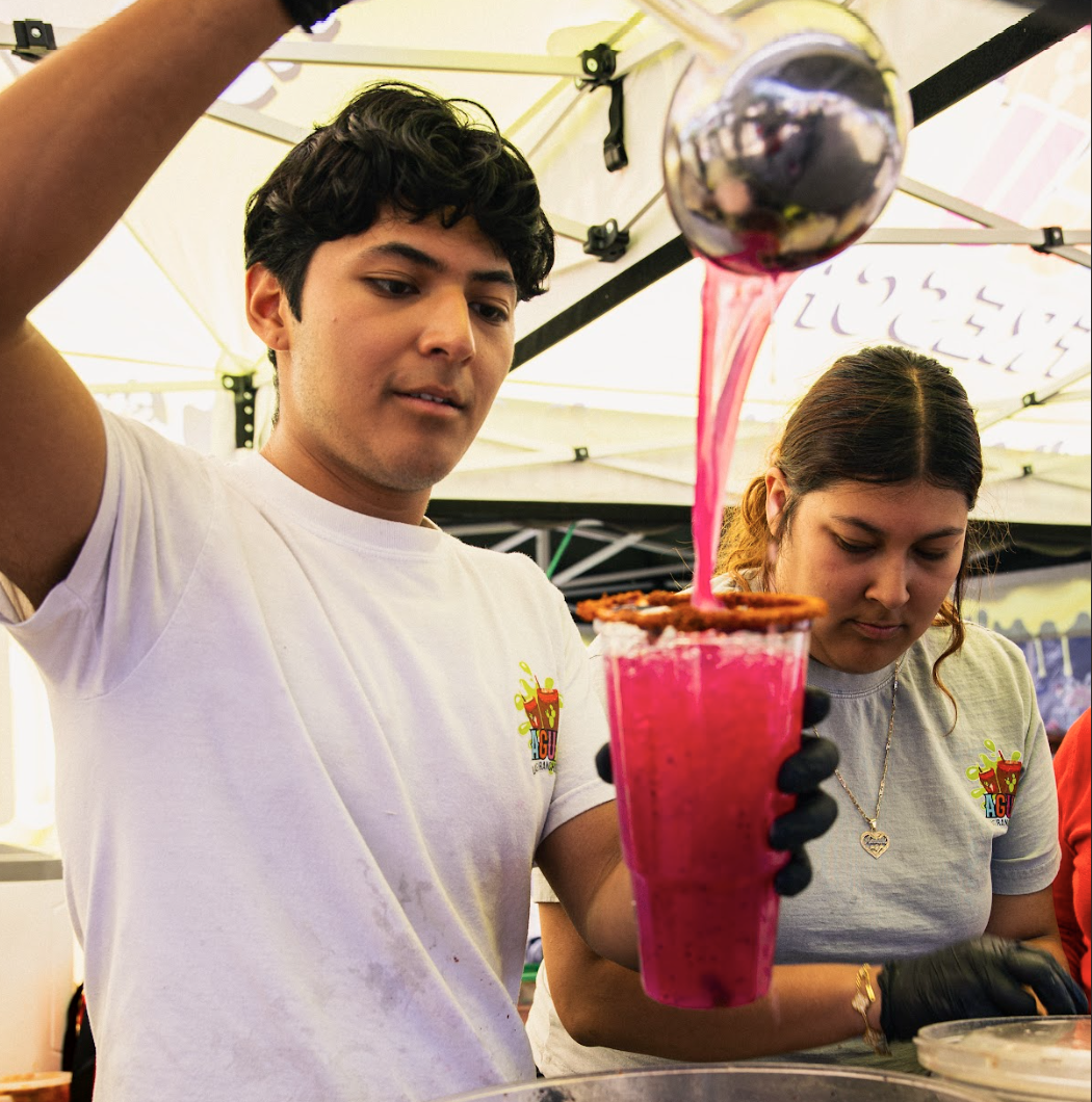 Student club food booth serves with a smile